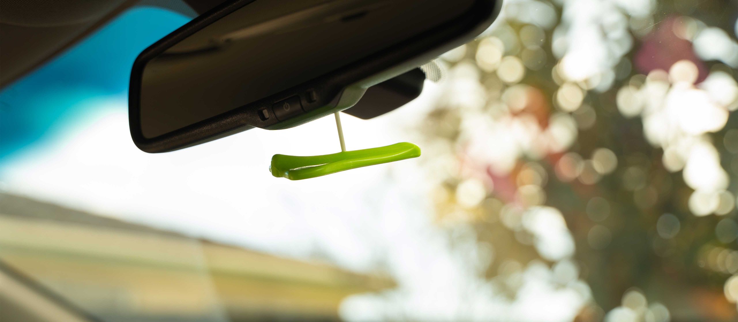 Jelly Jets Bubble Gum Air Freshener hanging from car mirror
